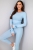 Niebieski dopasowany komplet RÓŻA  włoskiej produkcji, bluzka z różą 3d na rękawie i legginsami. Prążkowany materiał z wiskozy. casual set, basic. Idealne dopasowanie do sylwetki i jej podkreślenie. Komplet można urozmaicić marynarką lub kurtką.