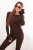 Brązowy dopasowany komplet RÓŻA  włoskiej produkcji, bluzka z różą 3d na rękawie i legginsami. Prążkowany materiał z wiskozy. casual set, basic. Idealne dopasowanie do sylwetki i jej podkreślenie. Komplet można urozmaicić marynarką lub kurtką.